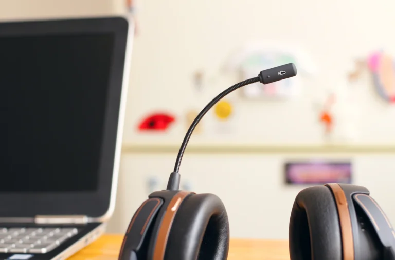 Support headset next to a laptop on a desk