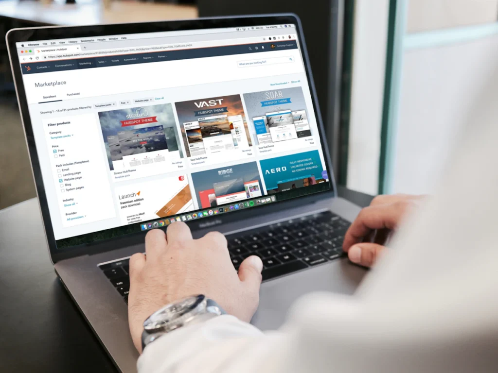 Person updating a website on a laptop